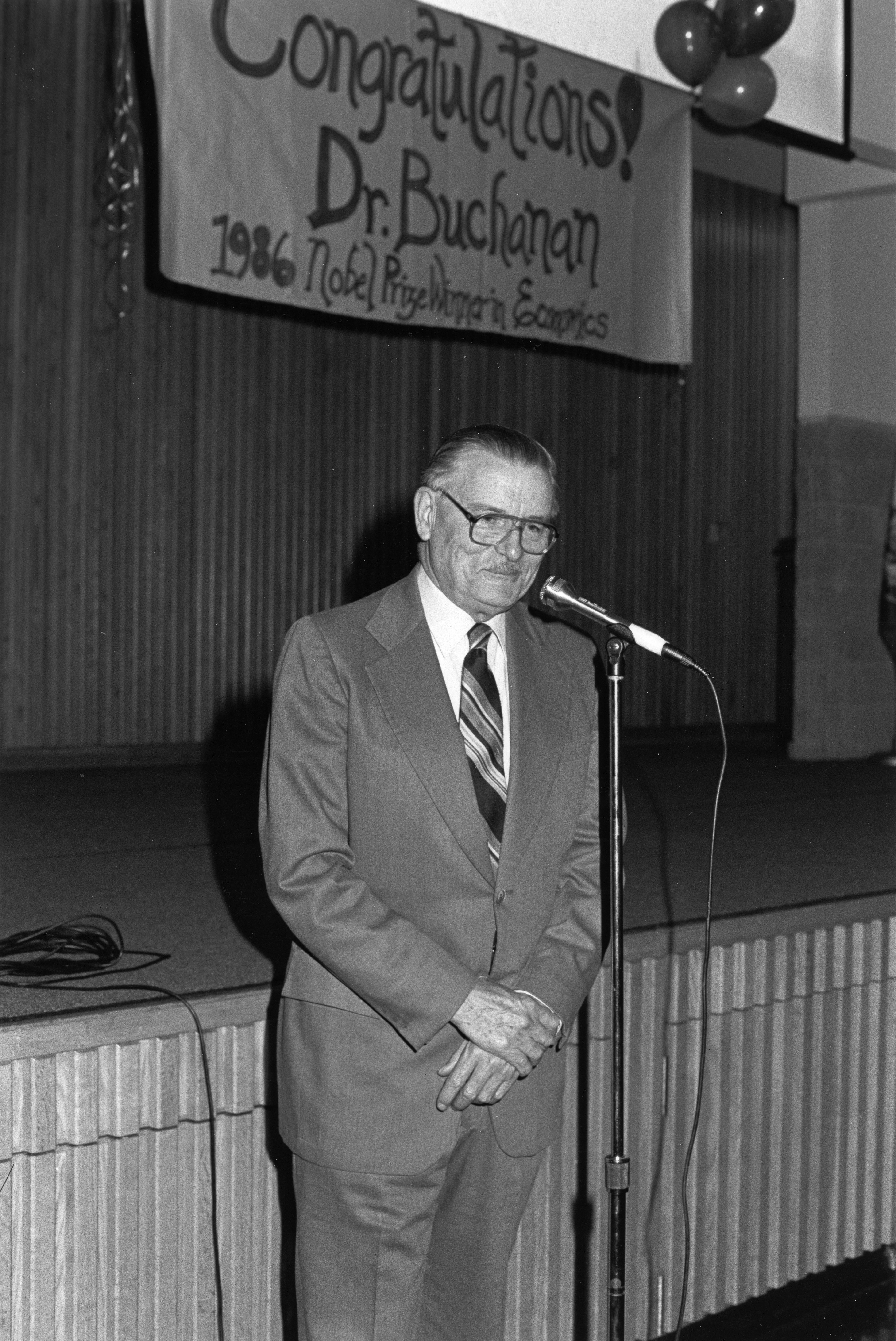 George Mason University Nobel laureate James M. Buchanan speaks at a reception in his honor, October 1986.
