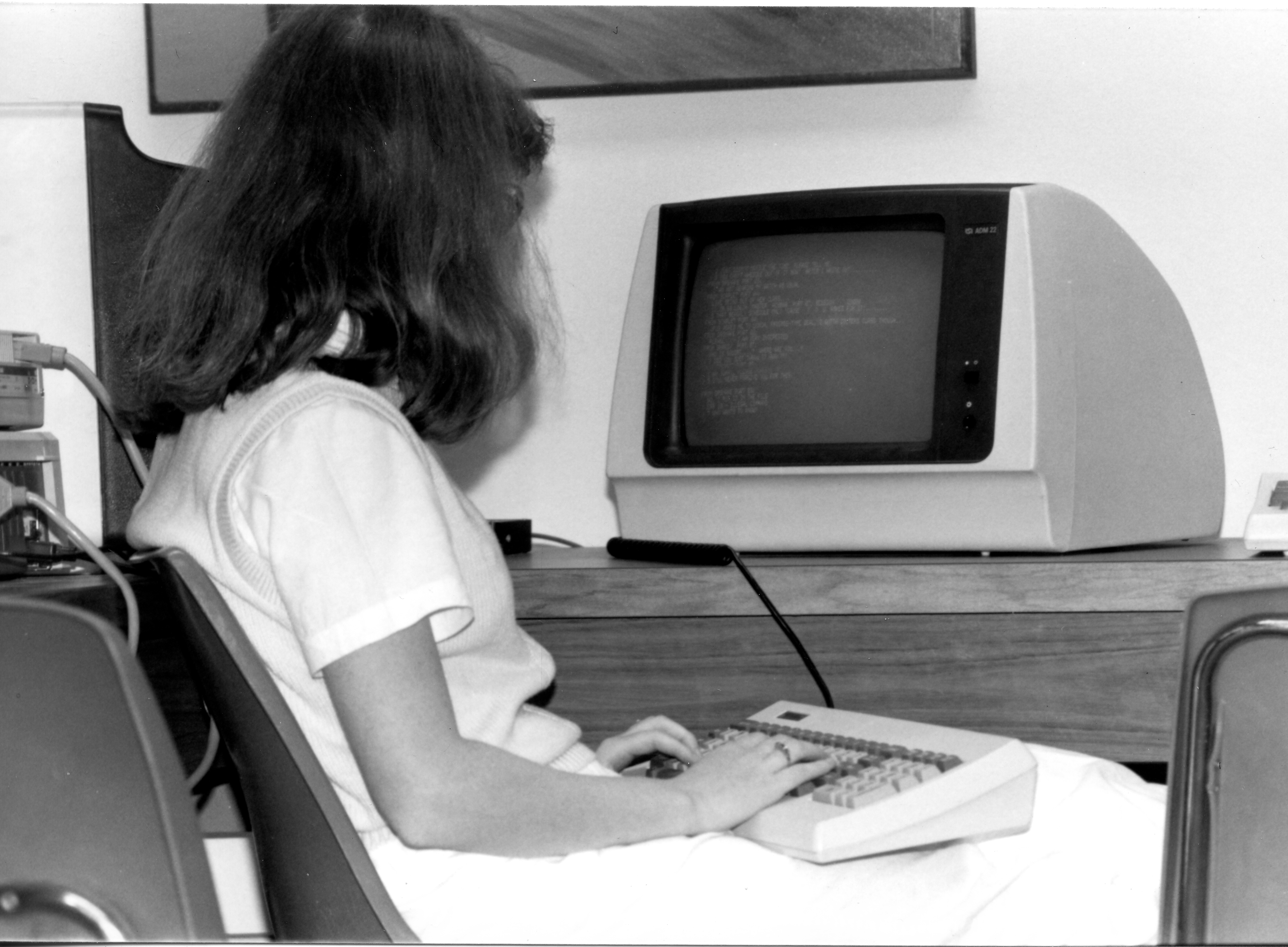 Plan for Alternative General Education (PAGE) Student sits at a computer in the PAGE lounge, ca. 1985