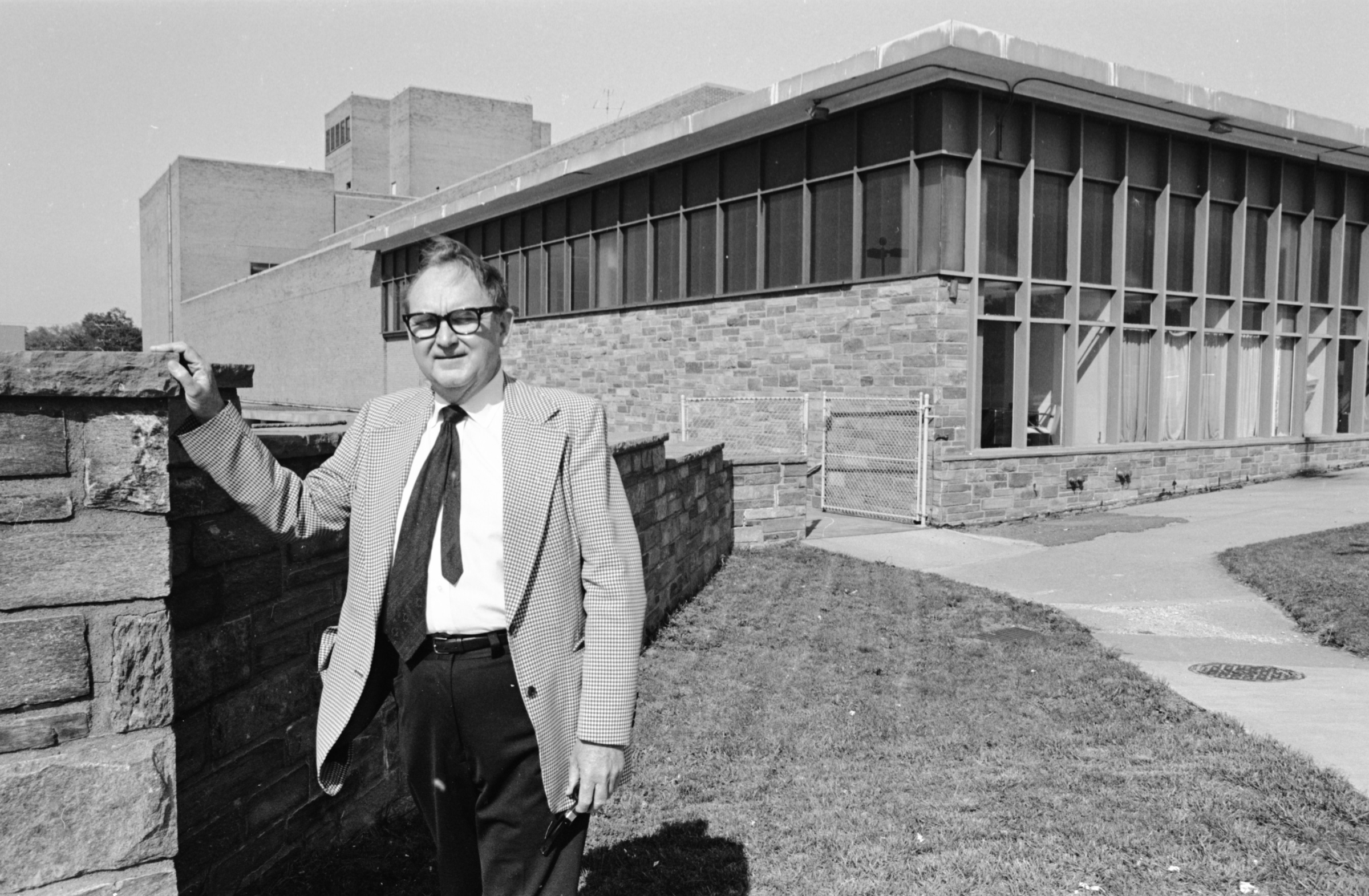 George Mason University School of Law Dean, Ralph N. Norvell in front of the School of Law building 